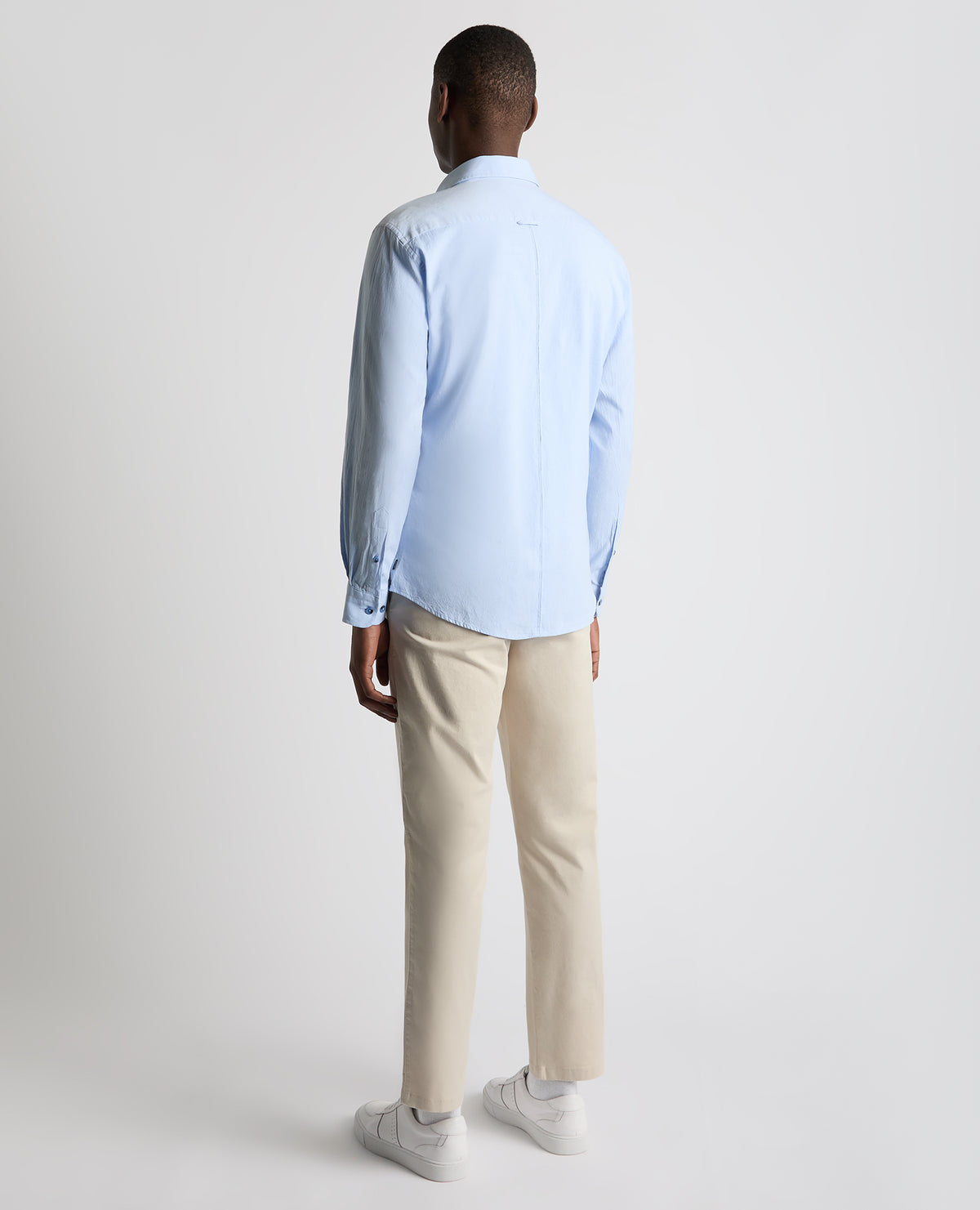 Man wearing a blue Tapered Fit Oxford Cotton Shirt