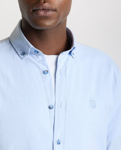 Man wearing a blue Tapered Fit Oxford Cotton Shirt