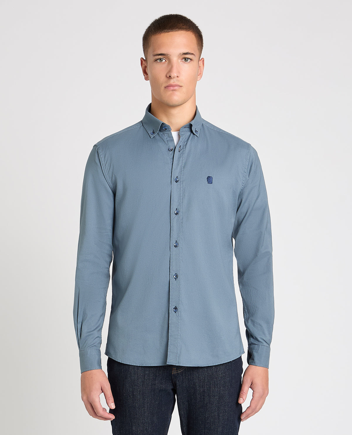Man wearing a blue casual shirt
