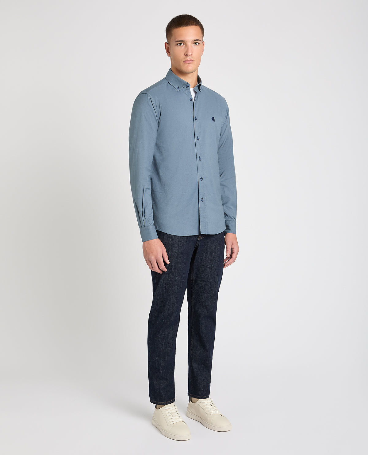 Man wearing a blue casual shirt