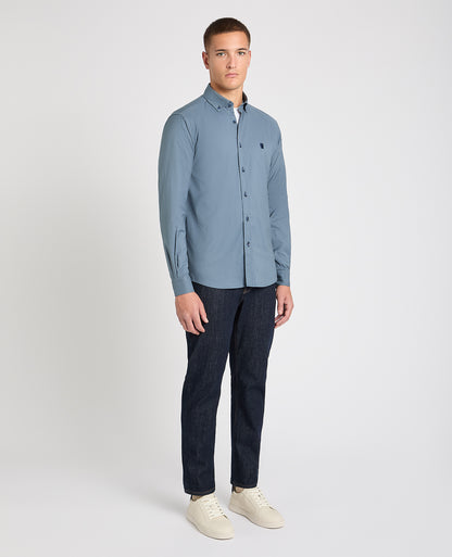 Man wearing a blue casual shirt