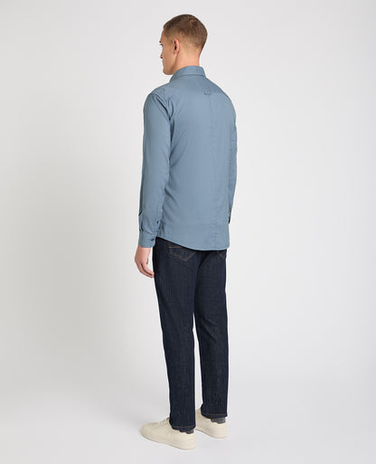 Man wearing a blue casual shirt