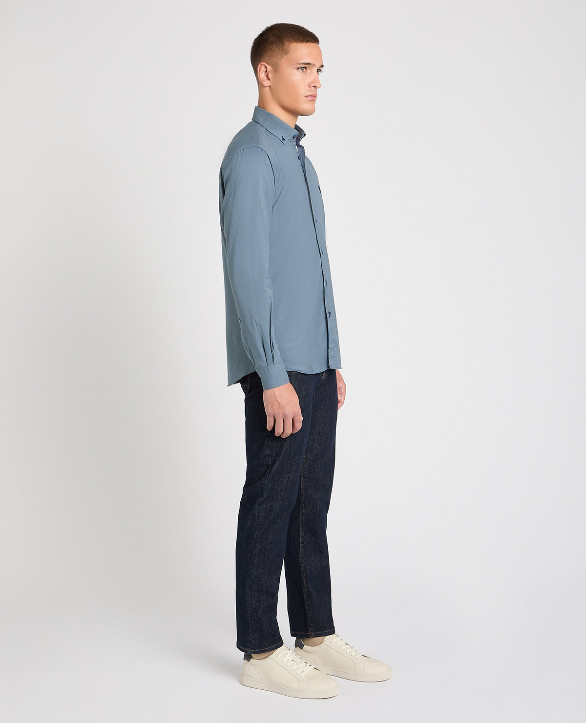 Man wearing a blue casual shirt