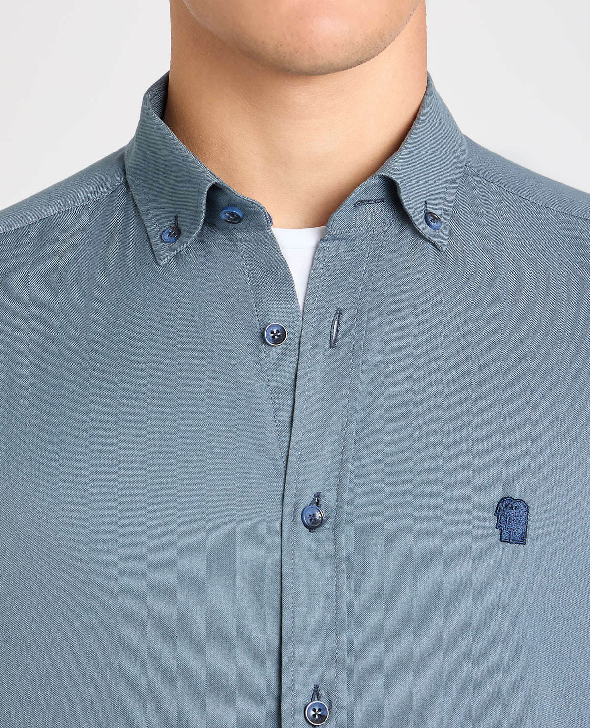 Man wearing a blue casual shirt
