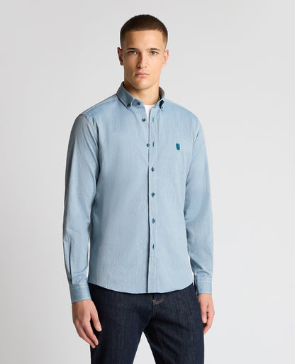 Man wearing a blue casual shirt
