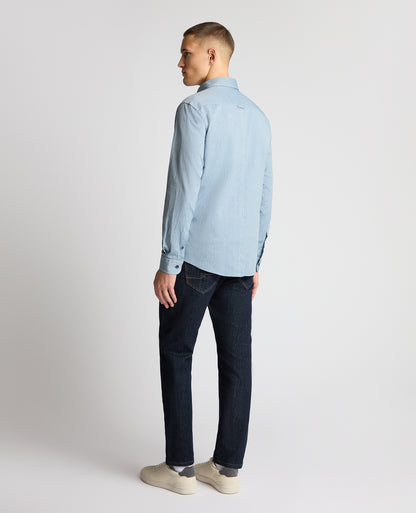 Man wearing a blue casual shirt