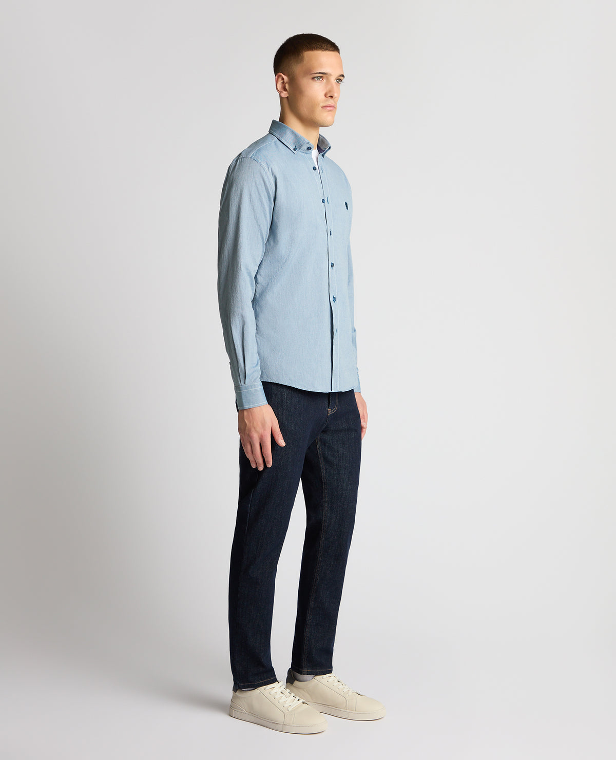 Man wearing a blue casual shirt