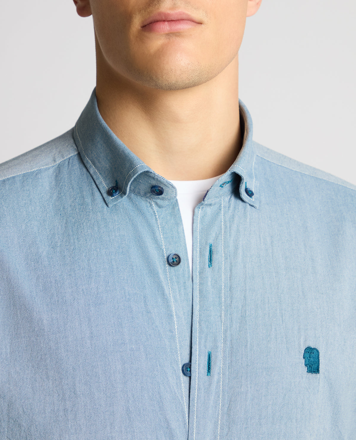 Man wearing a blue casual shirt