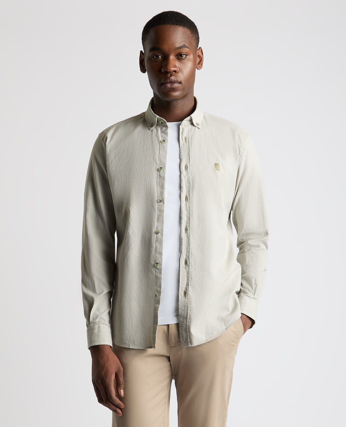 Man wearing a green Tapered Fit Oxford Cotton Shirt