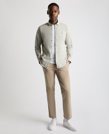 Man wearing a green Tapered Fit Oxford Cotton Shirt