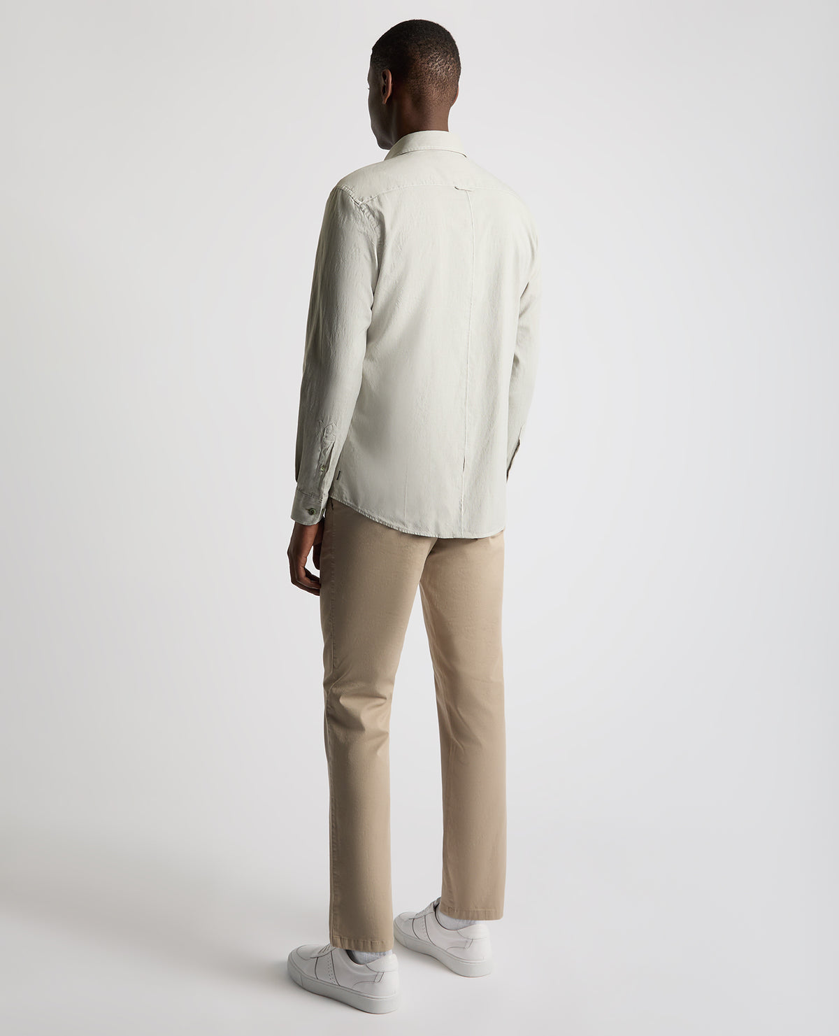 Man wearing a green Tapered Fit Oxford Cotton Shirt