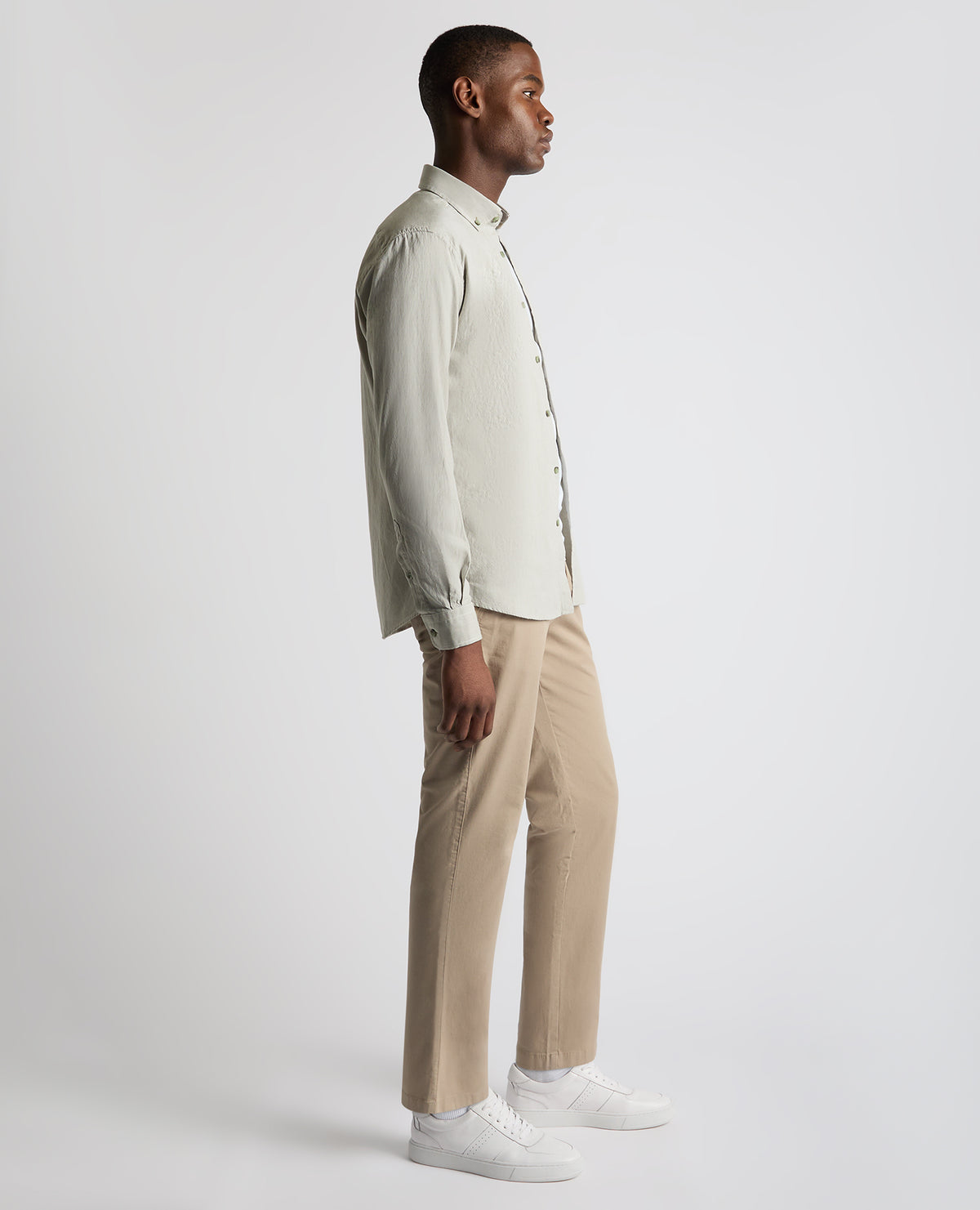 Man wearing a green Tapered Fit Oxford Cotton Shirt