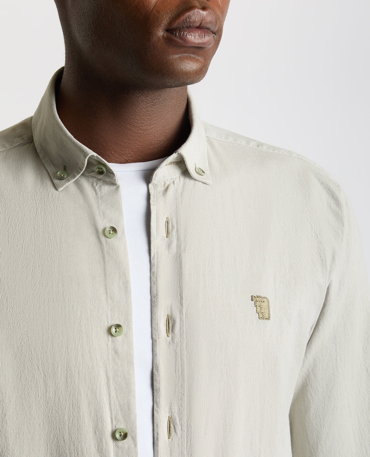 Man wearing a green Tapered Fit Oxford Cotton Shirt