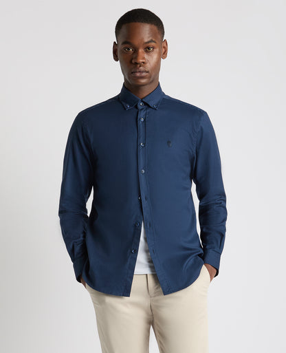 Man wearing a navy Tapered Fit Oxford Cotton Shirt
