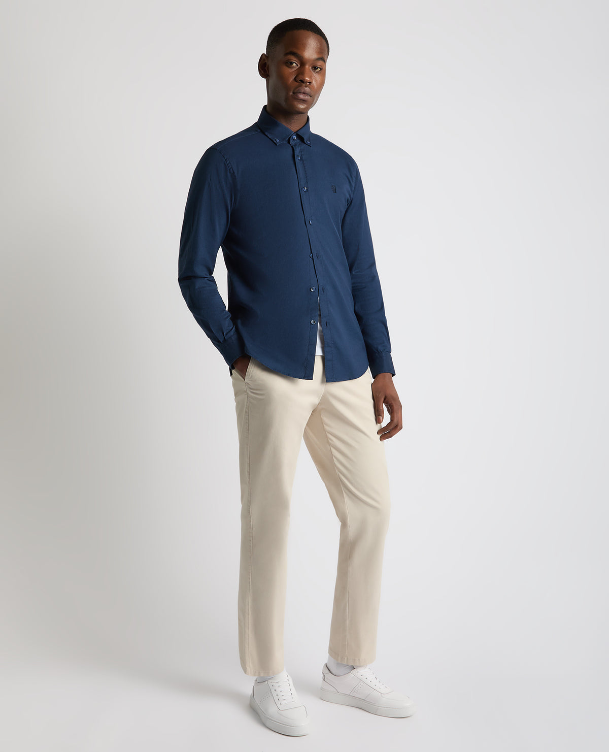 Man wearing a navy Tapered Fit Oxford Cotton Shirt
