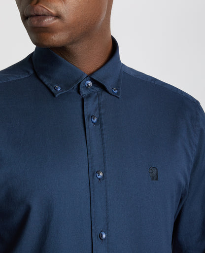 Man wearing a navy Tapered Fit Oxford Cotton Shirt