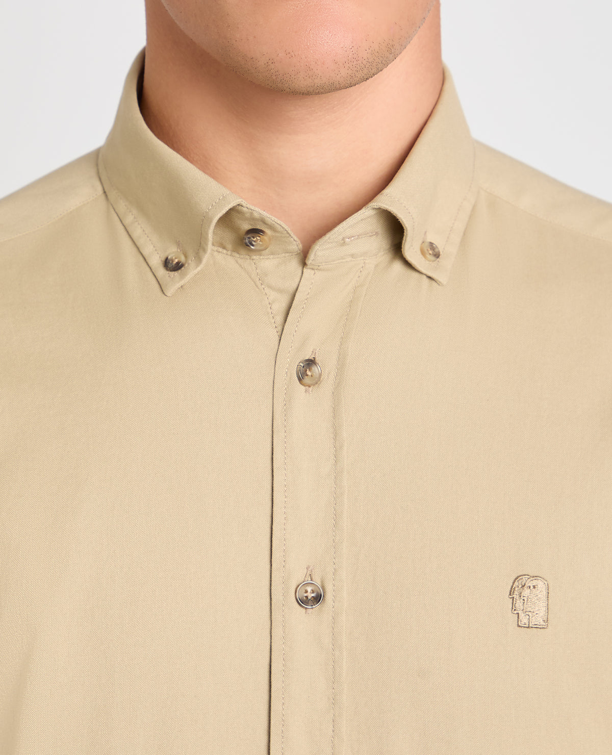 Man wearing a stone casual shirt