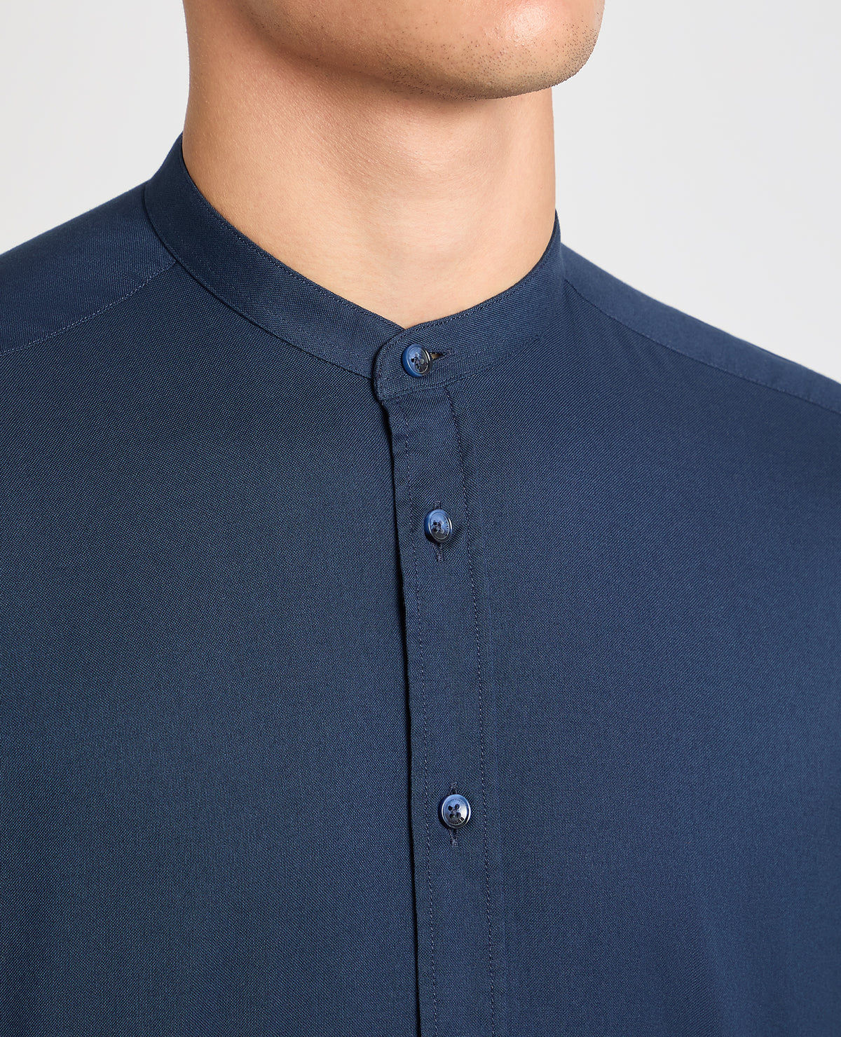 Man wearing a navy casual shirt