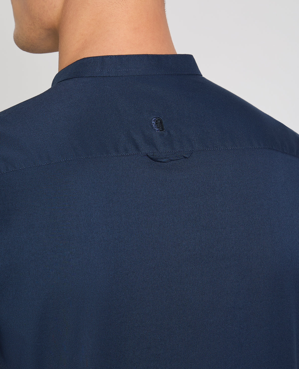 Man wearing a navy casual shirt