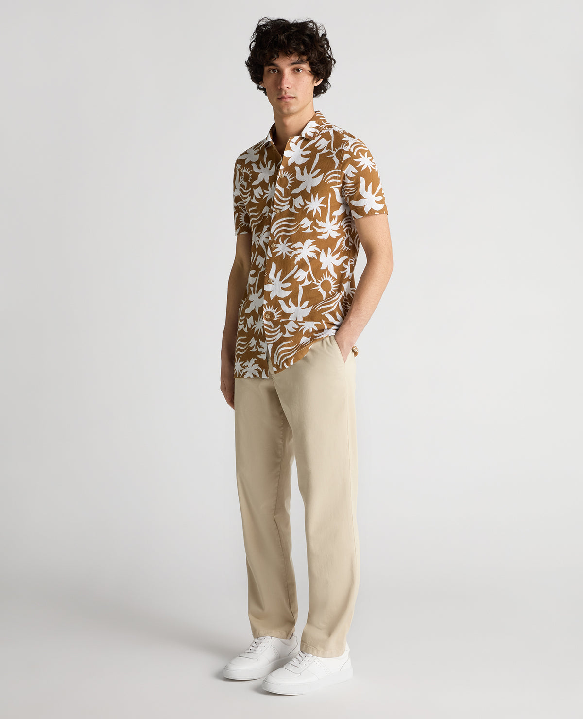 Man wearing a brown Tapered Fit Floral Print Cotton Shirt