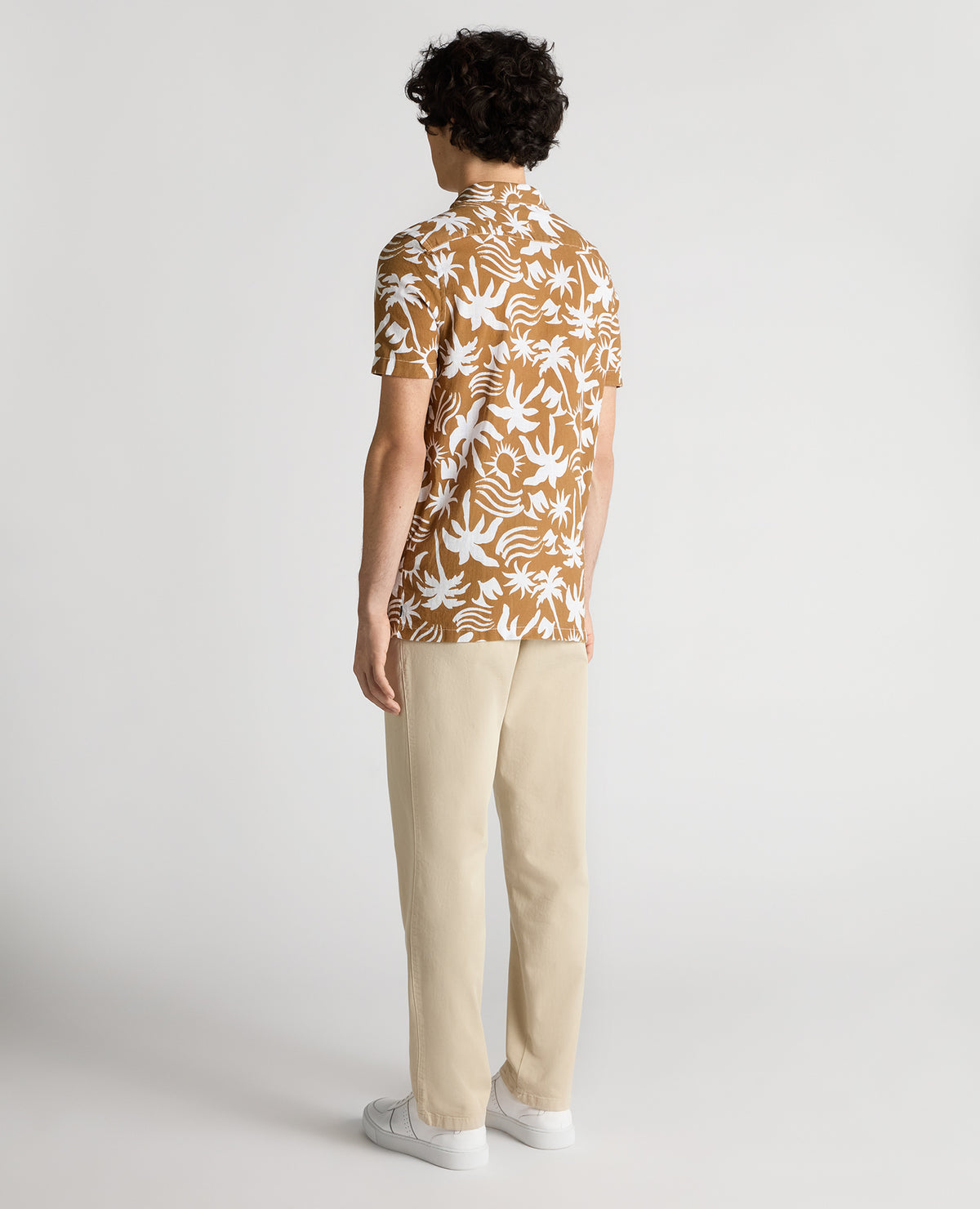 Man wearing a brown Tapered Fit Floral Print Cotton Shirt