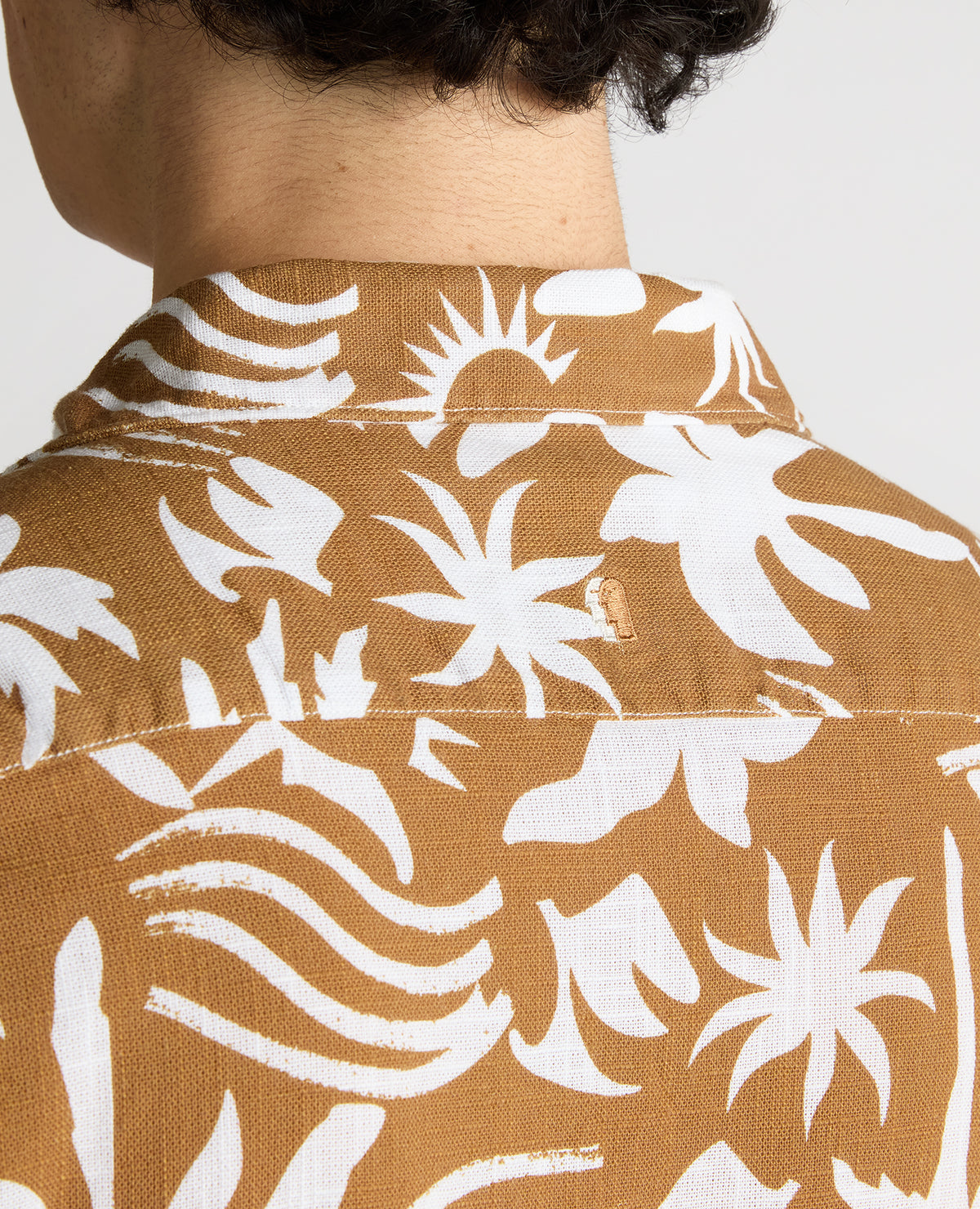 Man wearing a brown Tapered Fit Floral Print Cotton Shirt