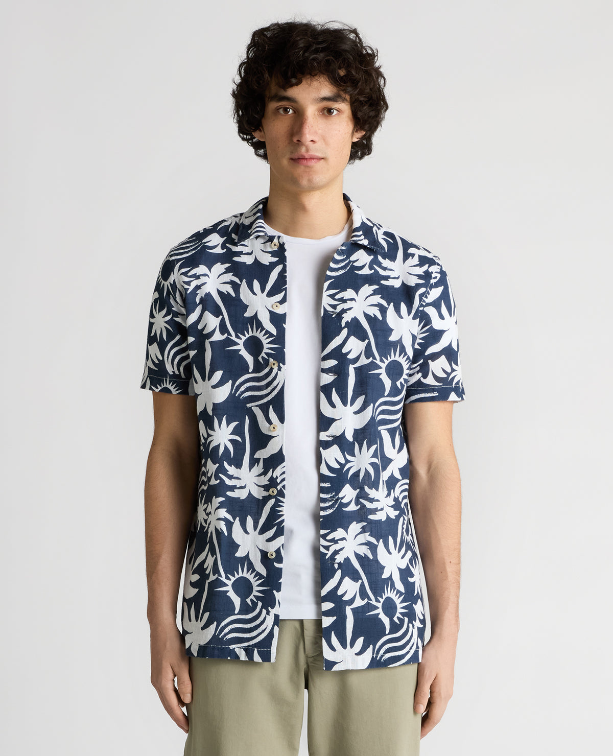 Man wearing a navy Tapered Fit Floral Print Cotton Shirt