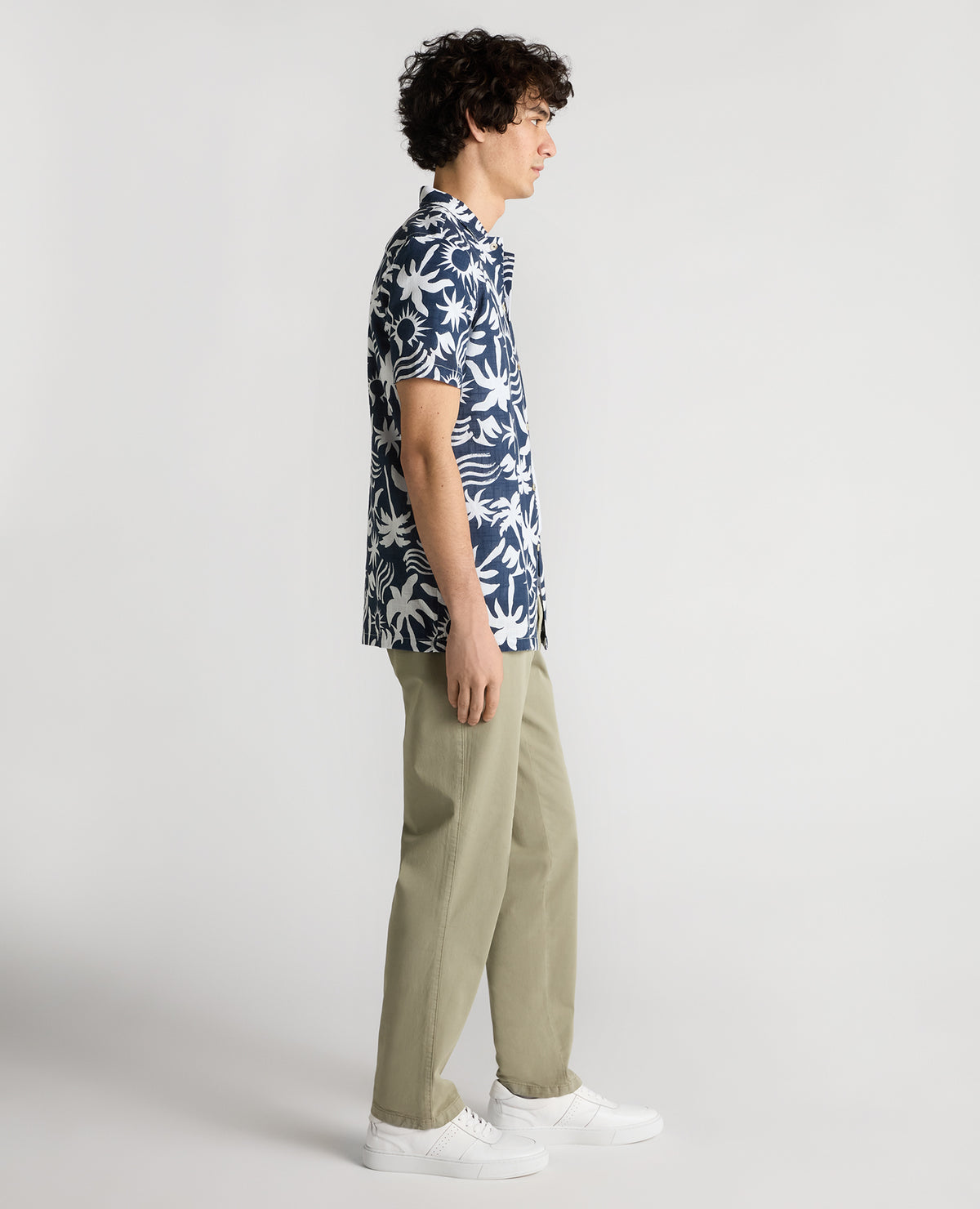 Man wearing a navy Tapered Fit Floral Print Cotton Shirt