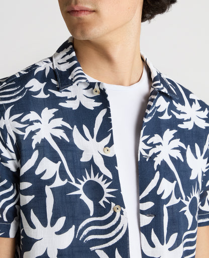 Man wearing a navy Tapered Fit Floral Print Cotton Shirt