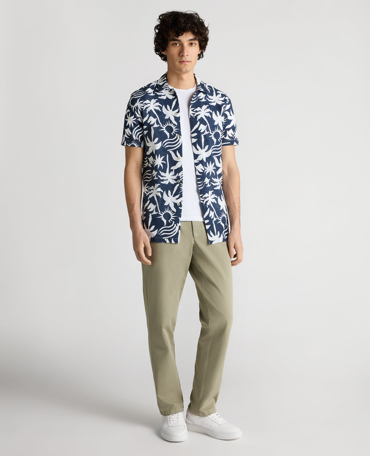 Man wearing a navy Tapered Fit Floral Print Cotton Shirt