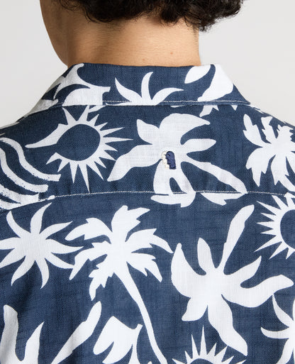 Man wearing a navy Tapered Fit Floral Print Cotton Shirt