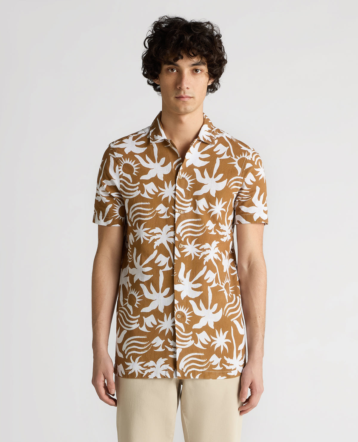 Man wearing a brown Tapered Fit Floral Print Cotton Shirt