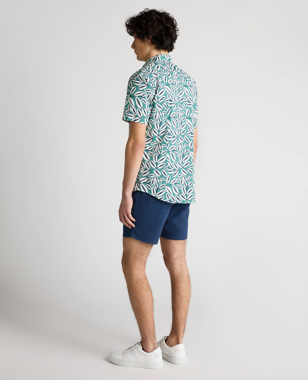 Man wearing a green Slim Fit Cotton Stretch Leaf Print Shirt