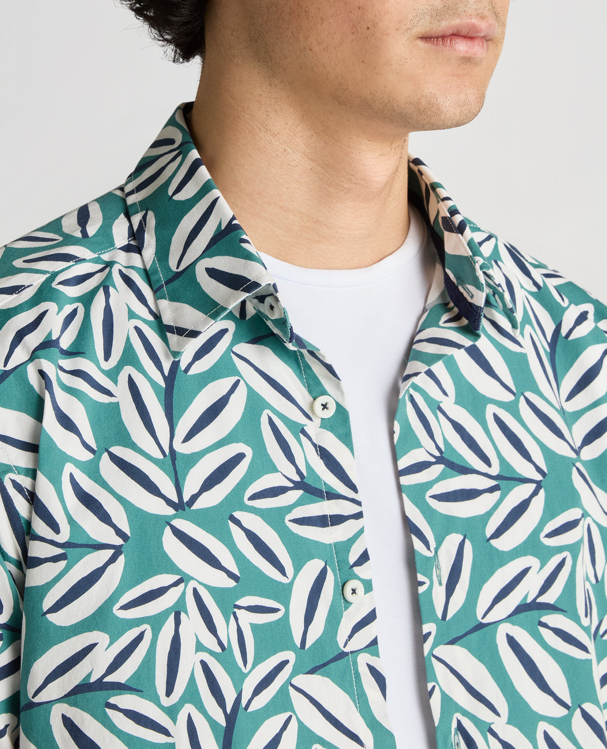 Man wearing a green Slim Fit Cotton Stretch Leaf Print Shirt