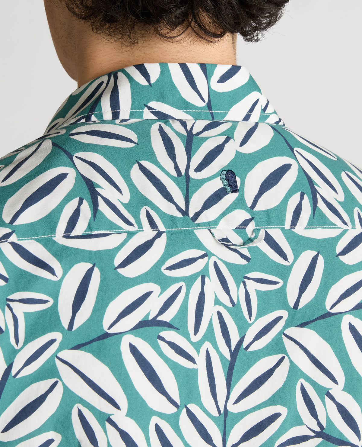 Man wearing a green Slim Fit Cotton Stretch Leaf Print Shirt