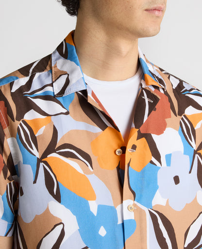 Man wearing a blue Tapered Fit Tencel Floral Print shirt