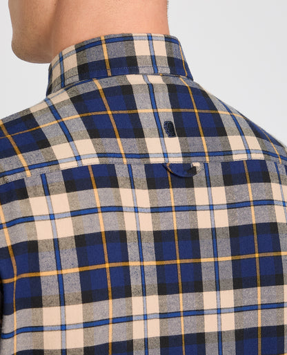 Man wearing a blue casual shirt
