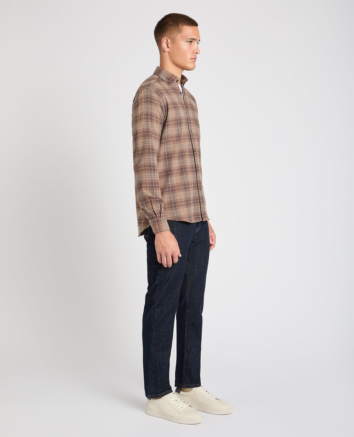 Man wearing a brown casual shirt