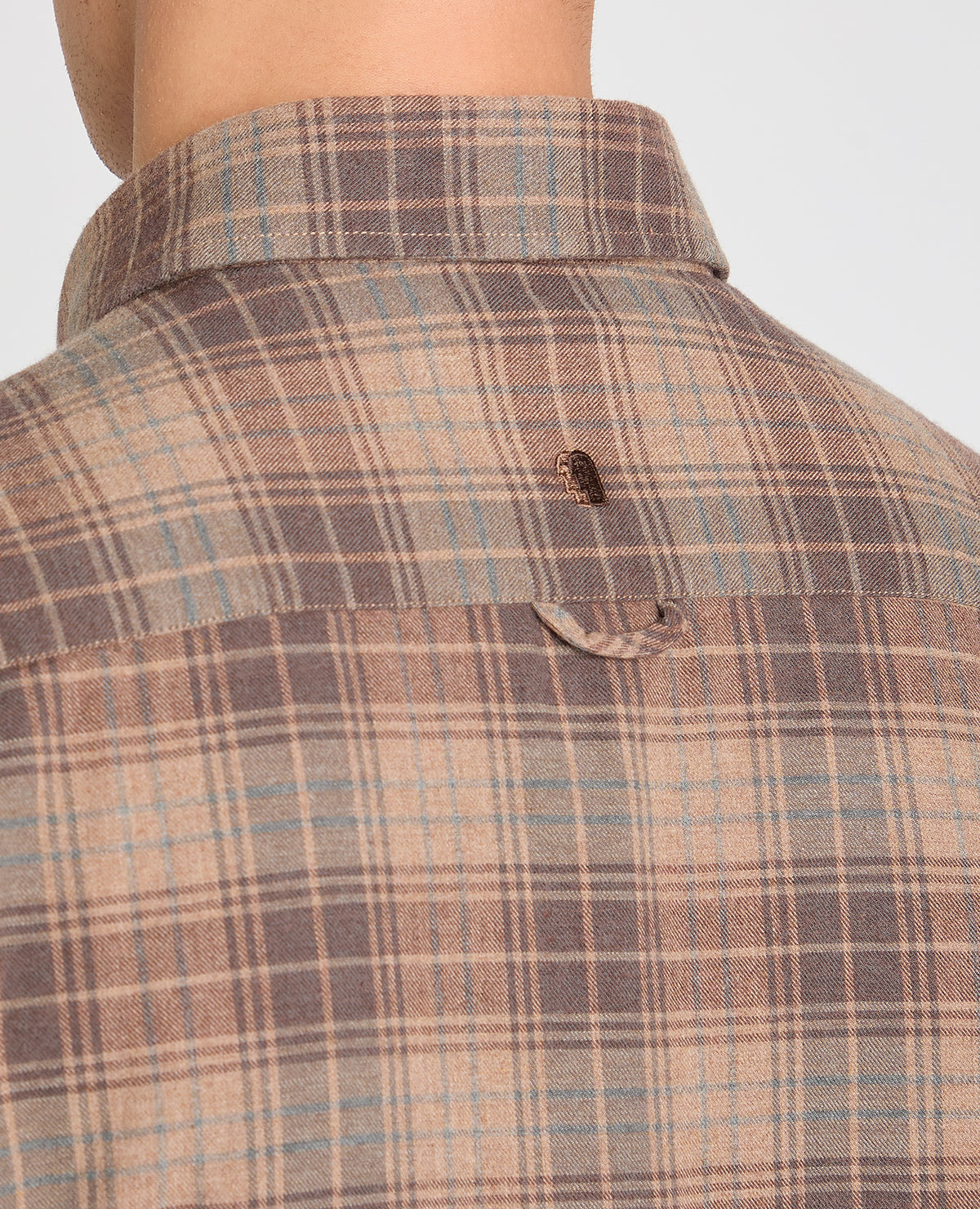 Man wearing a brown casual shirt