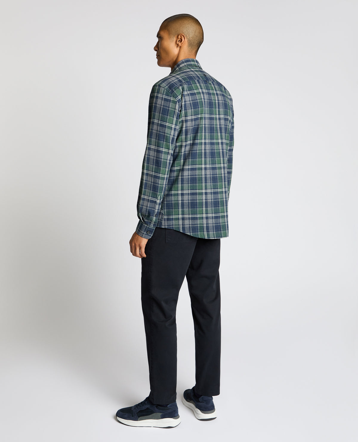 Man wearing a navy Tapered Fit Cotton-Blend Check Shirt