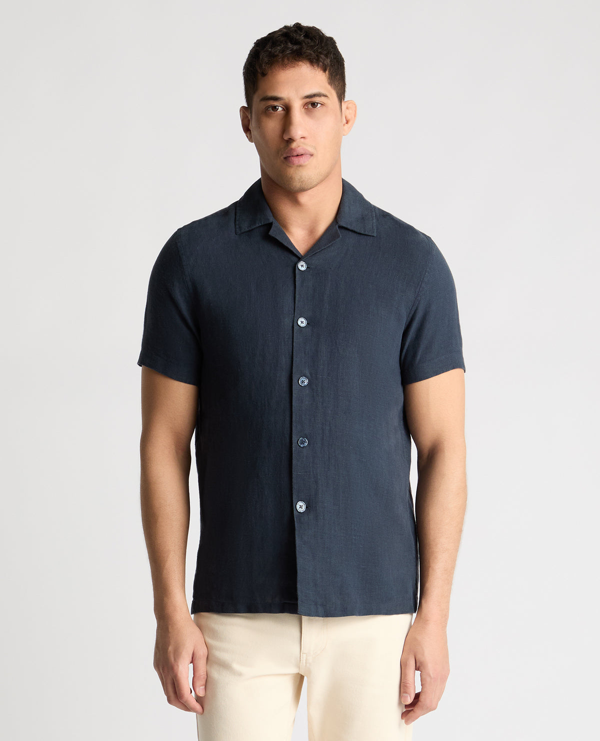 Man wearing a blue casual shirt