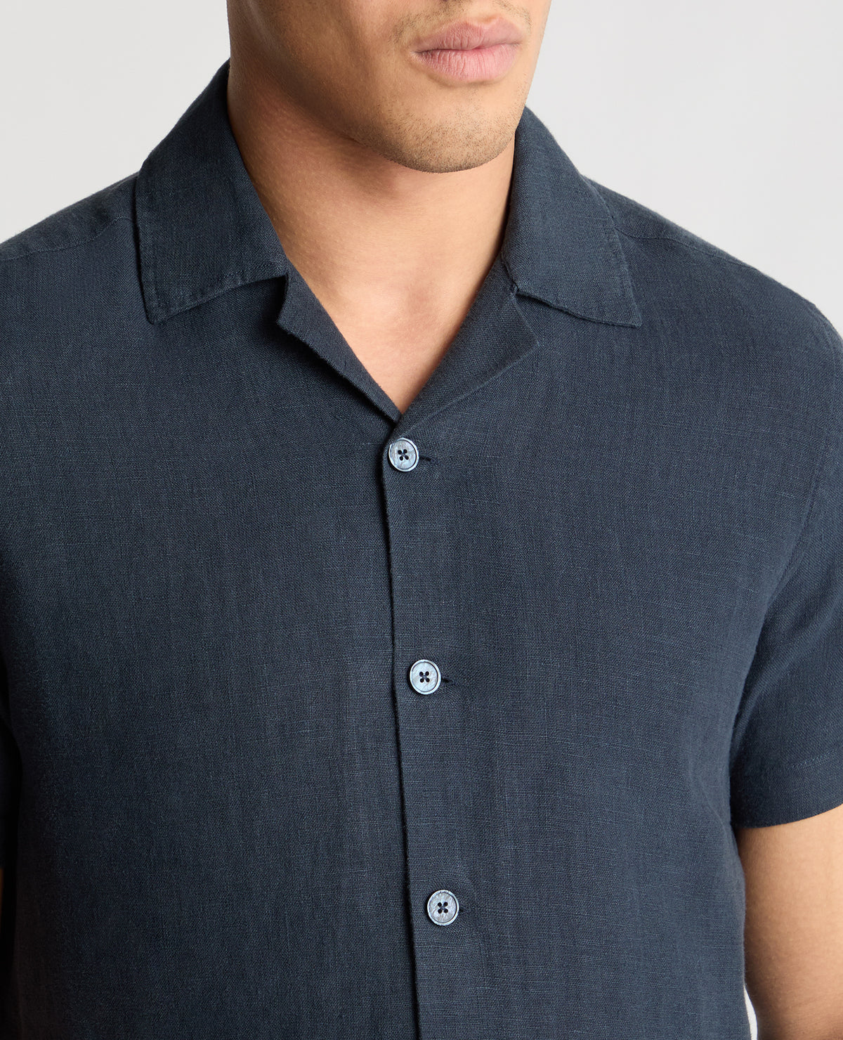 Man wearing a blue casual shirt