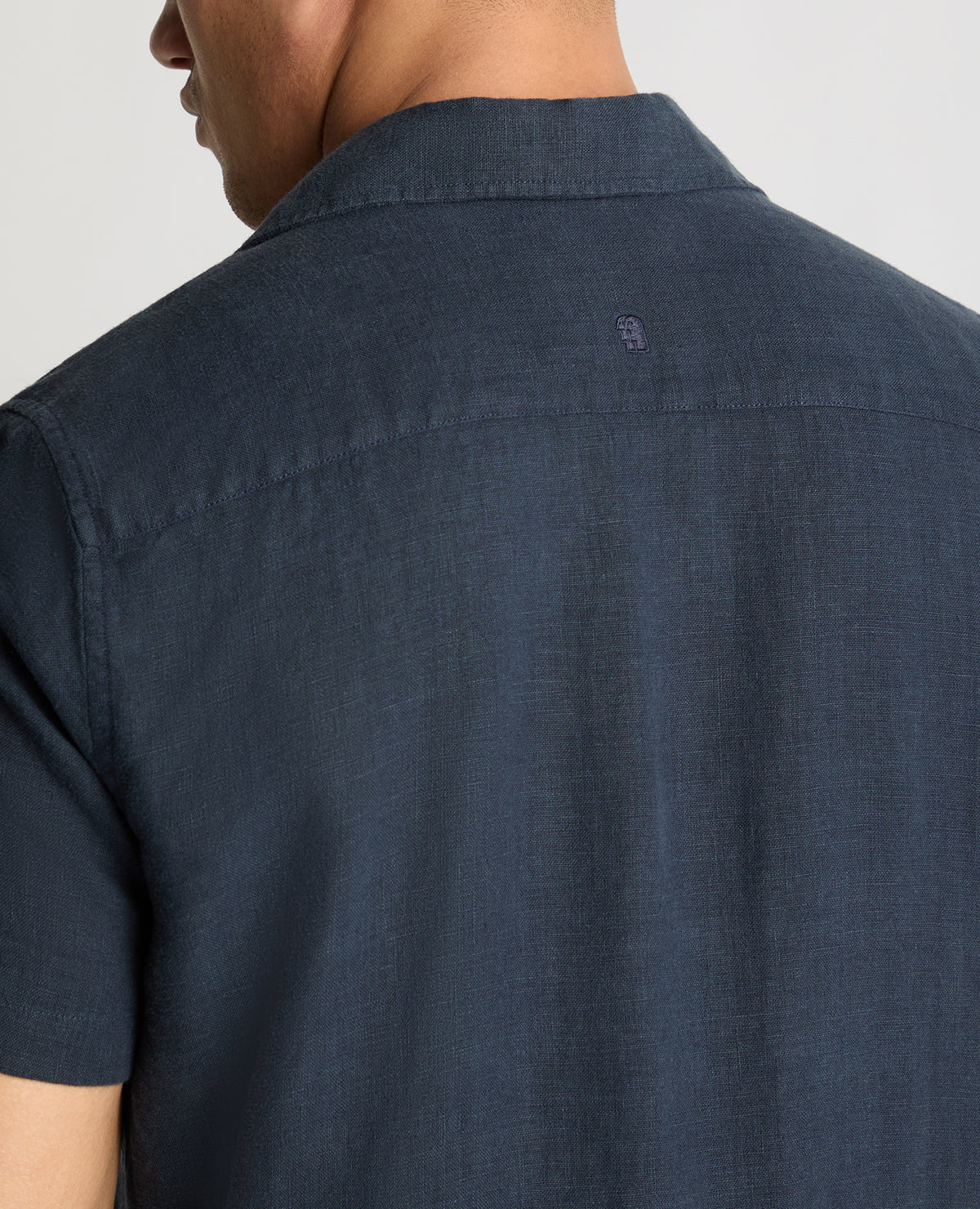 Man wearing a blue casual shirt
