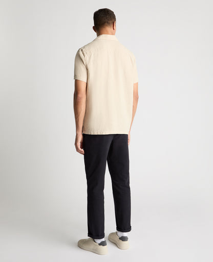 Man wearing a cream casual shirt