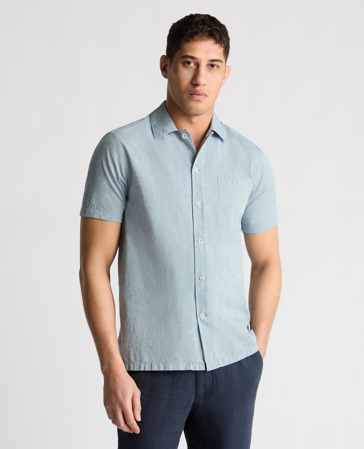 Man wearing a blue casual shirt