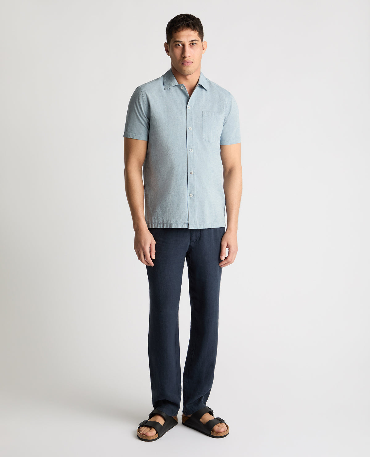 Man wearing a blue casual shirt