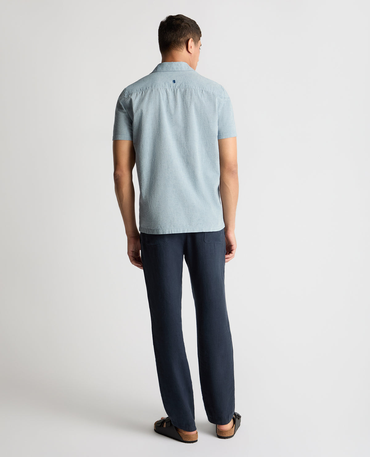 Man wearing a blue casual shirt
