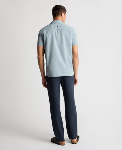 Man wearing a blue casual shirt
