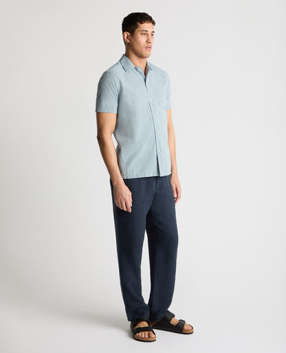 Man wearing a blue casual shirt