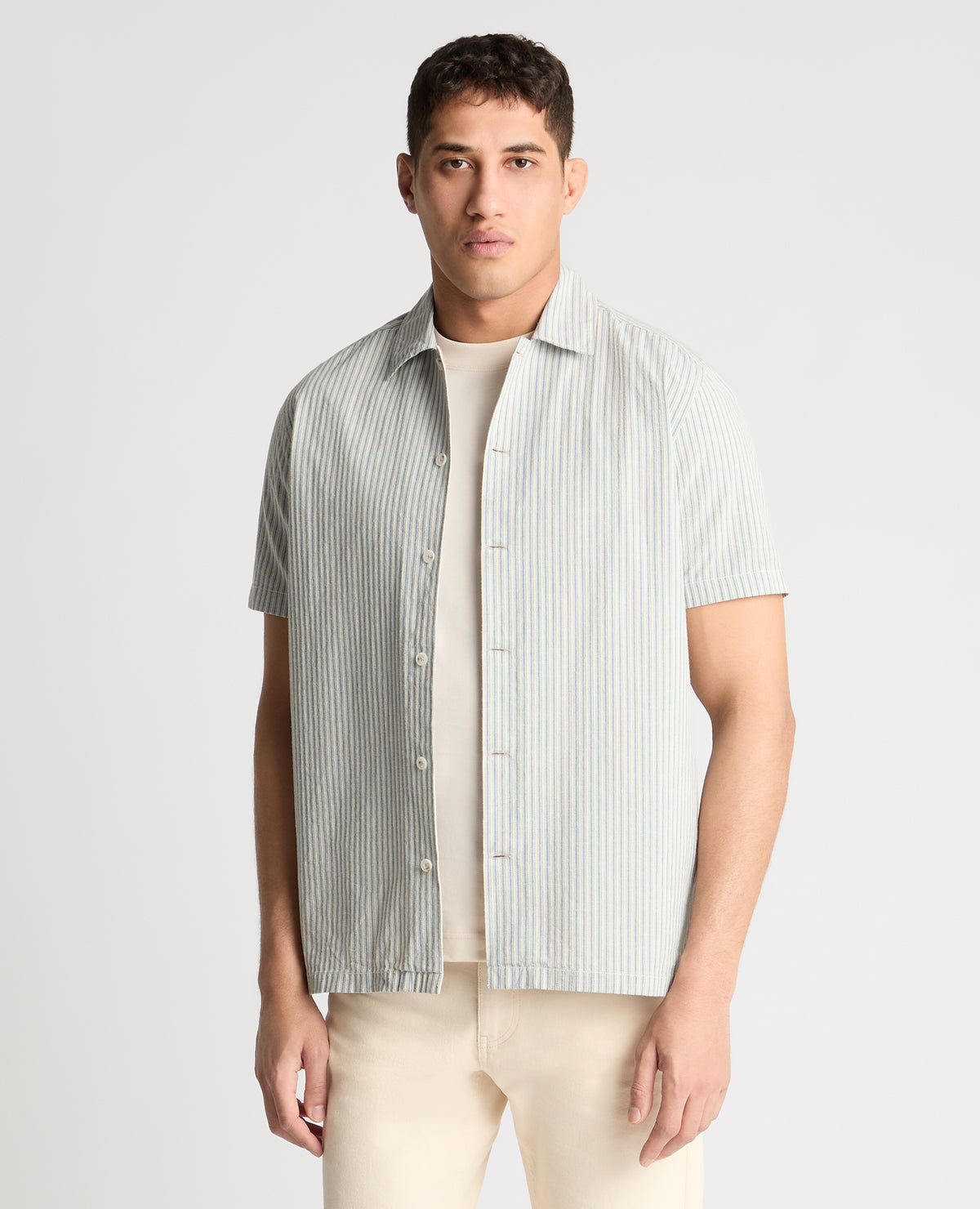 Man wearing a blue casual shirt
